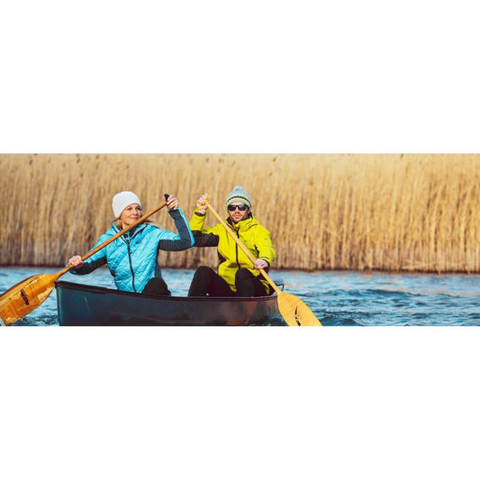 Man and woman paddling a canoe.