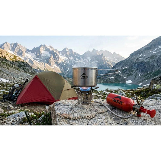 Liquid fuel camping stove with refillable fuel bottle for outdoor cooking