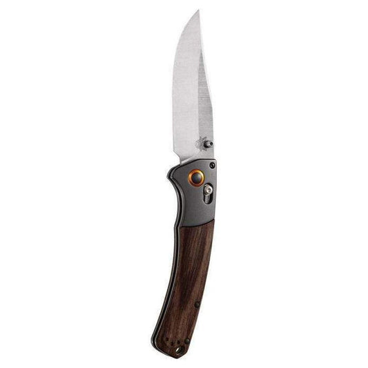 A side view of the Benchmade 15080-2 Crooked River knife with a wooden handle and charcoal/ graphite accents against a white background.