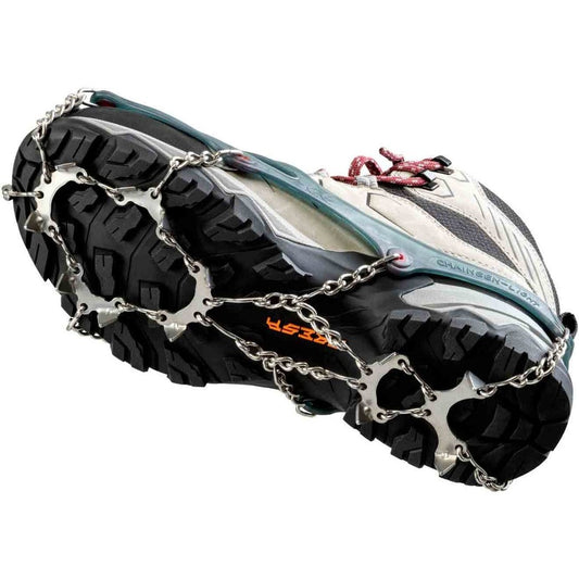 Close-up of the CAMP Spikes Light attached to a shoe showing the metal chain and spikes on the outsole.