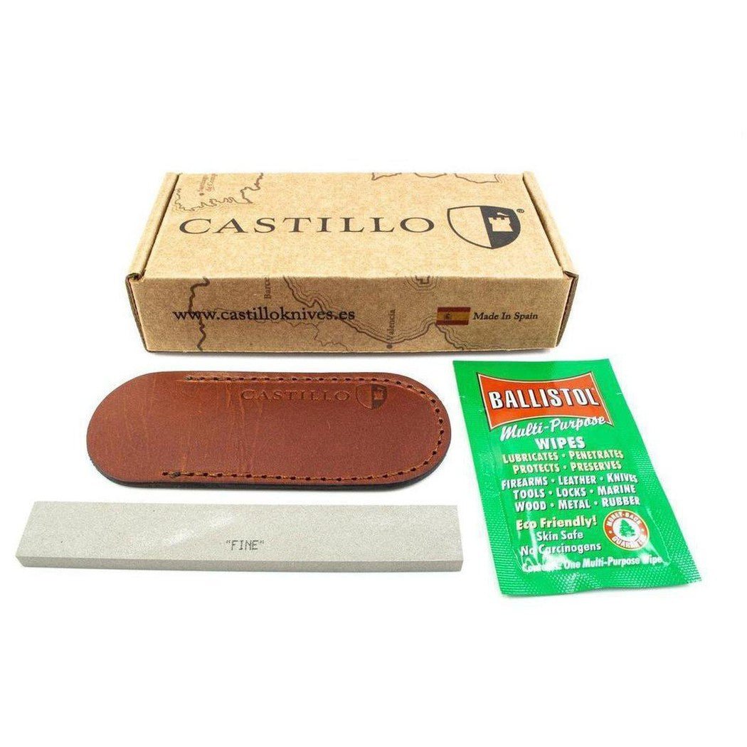 A box of Castillo knives with a brown leather sheath, a white sharpening stone, and Ballistol wipes on a white background.