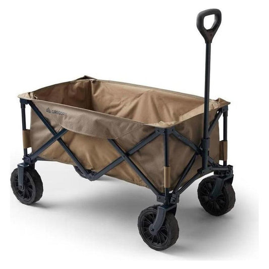 A side view of the Gregory Alpaca Gear Wagon in Mirage Tan with a black handle and wheels against a white background.
