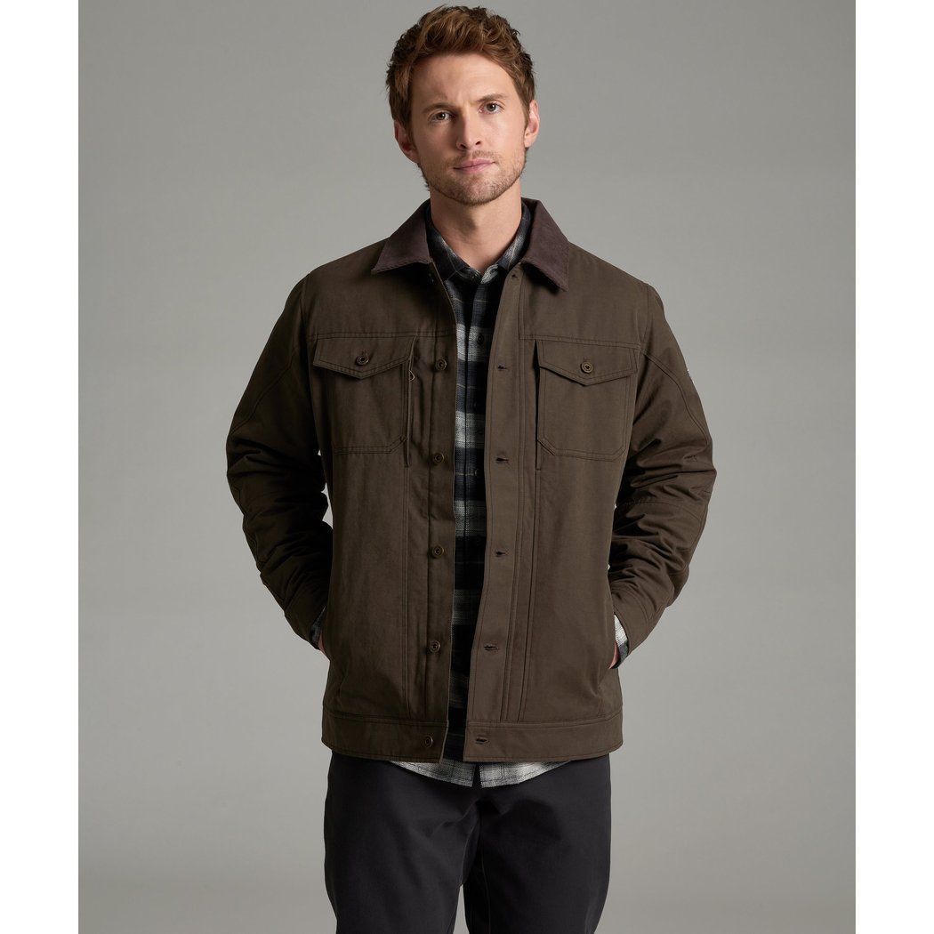 Front view of the Kuhl Maverick™ Jacket in Turkish Coffee on a man with hands in pockets against a gray background.