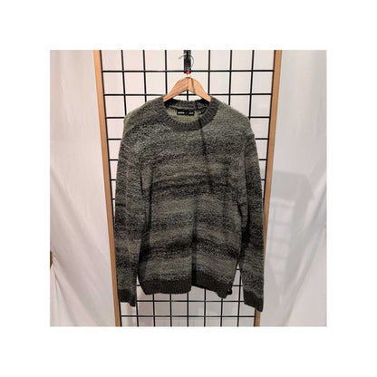 Front view of the Prana Mens Unbounded Sweater-SAMPLE in Nori hanging on a wooden hanger against a grid background.