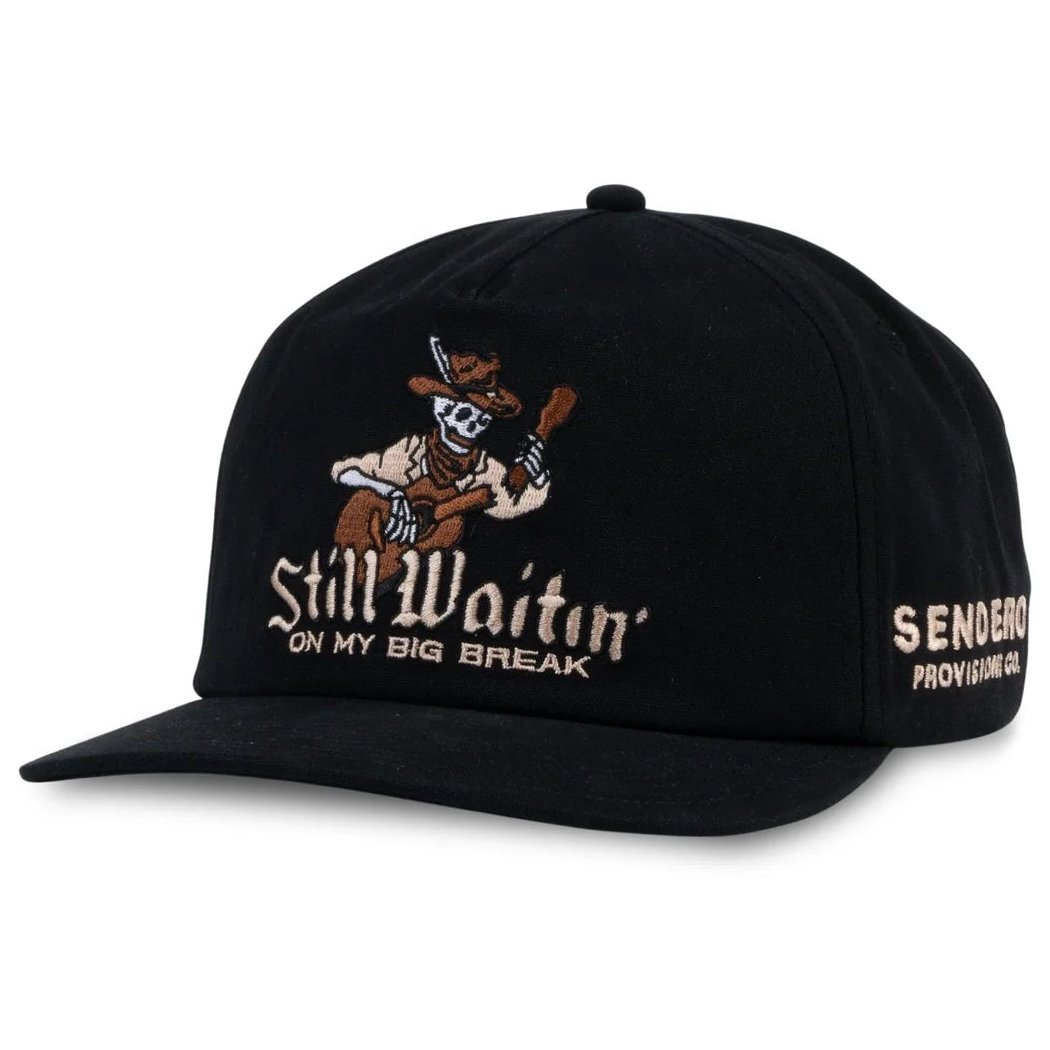 Angled front view of the Black Sendero Big Break Hat - Sample showing skeleton embroidery on a plain background.
