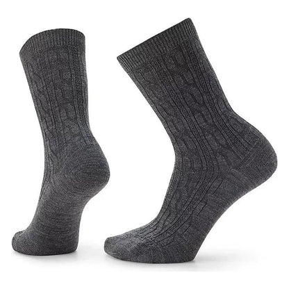 Side view of the Smartwool Women's Everyday Cable Crew Socks in Black showing the cable knit pattern against a white background.