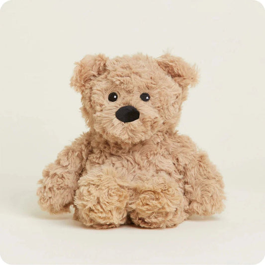 A front view of the Warmies Bear Junior plush toy with a soft, light brown fur texture against a plain white background.