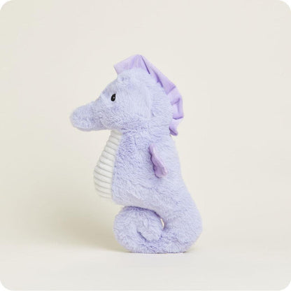 Side view of the Warmies Seahorse plush toy with a white ribbed belly against a plain background.