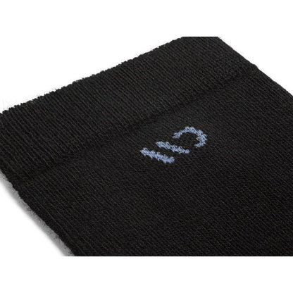 Close-up of the Wide Open Women's Solid Cushioned Crew Socks in Black showing the light blue logo on the black fabric.